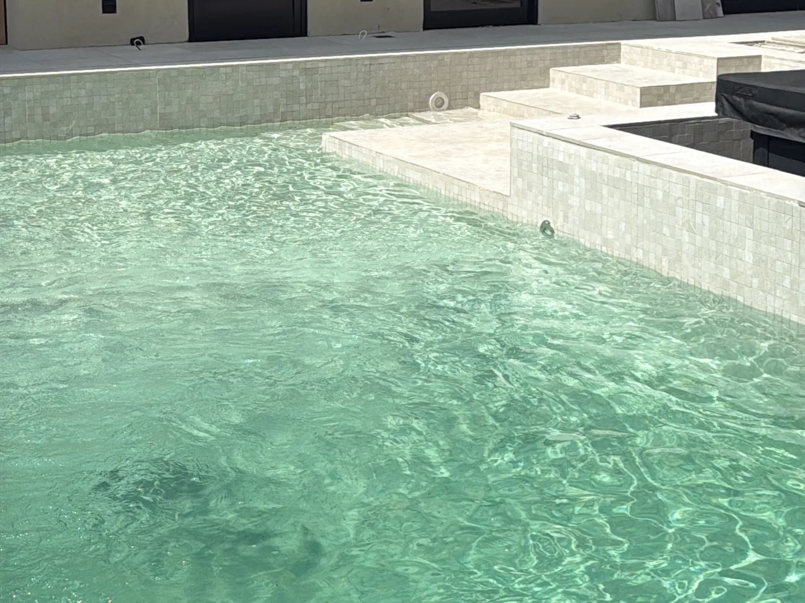 A villa pool in Dubai filled to the skimmer with clean sweet water